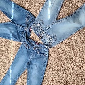 Angel jeans. Blue pinstripe are both same size 3 and 5. Other is 1
